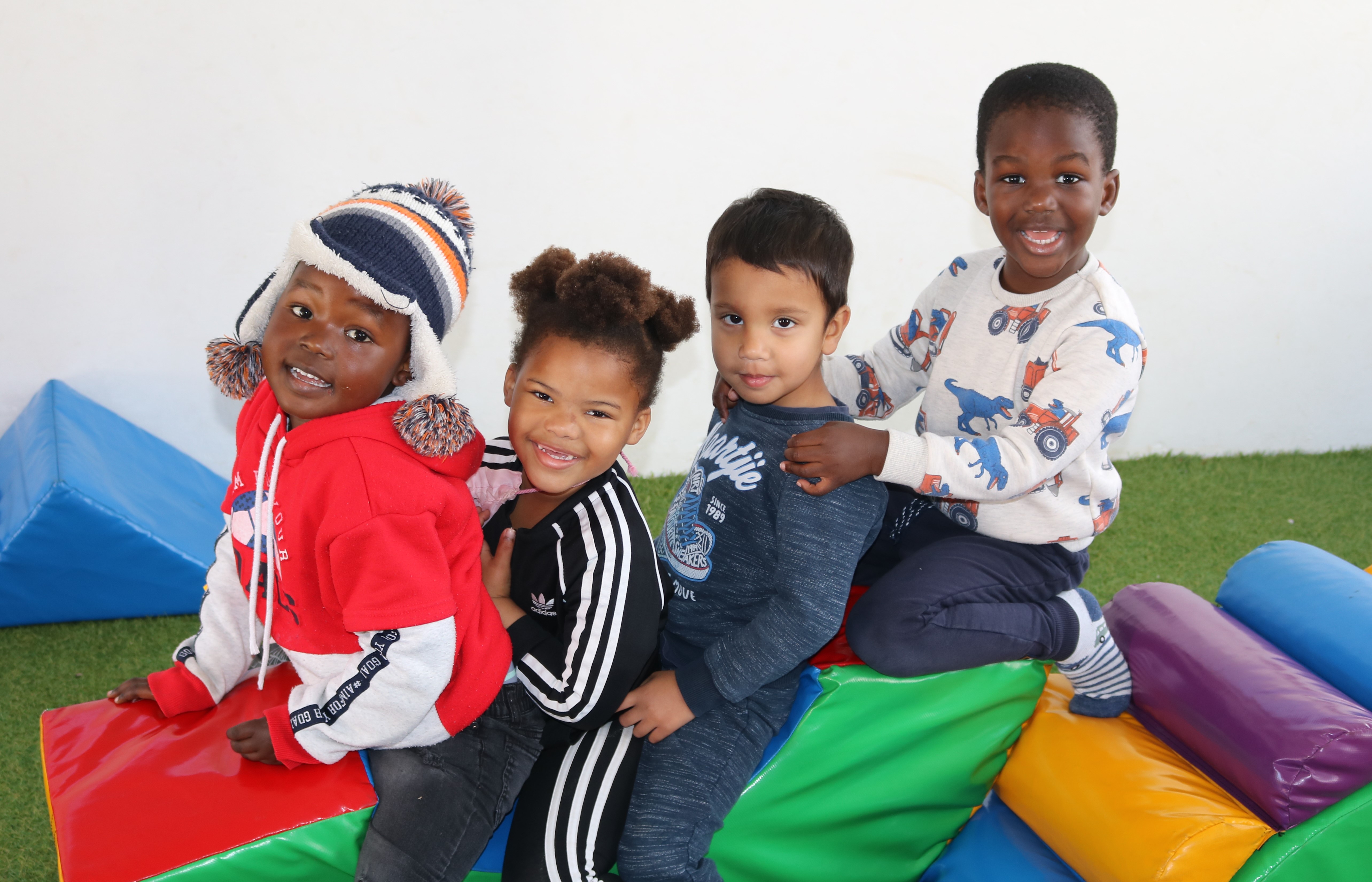 St George's Prep | Four smiling children | Daycare | Preschool